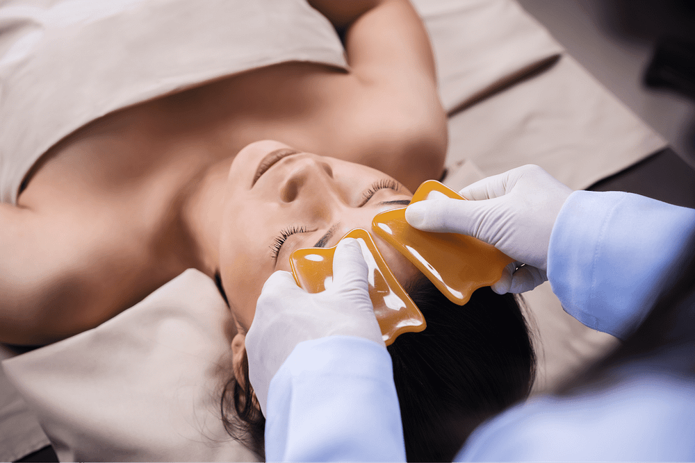 woman-receiving-traditional-guasa-face-therapy